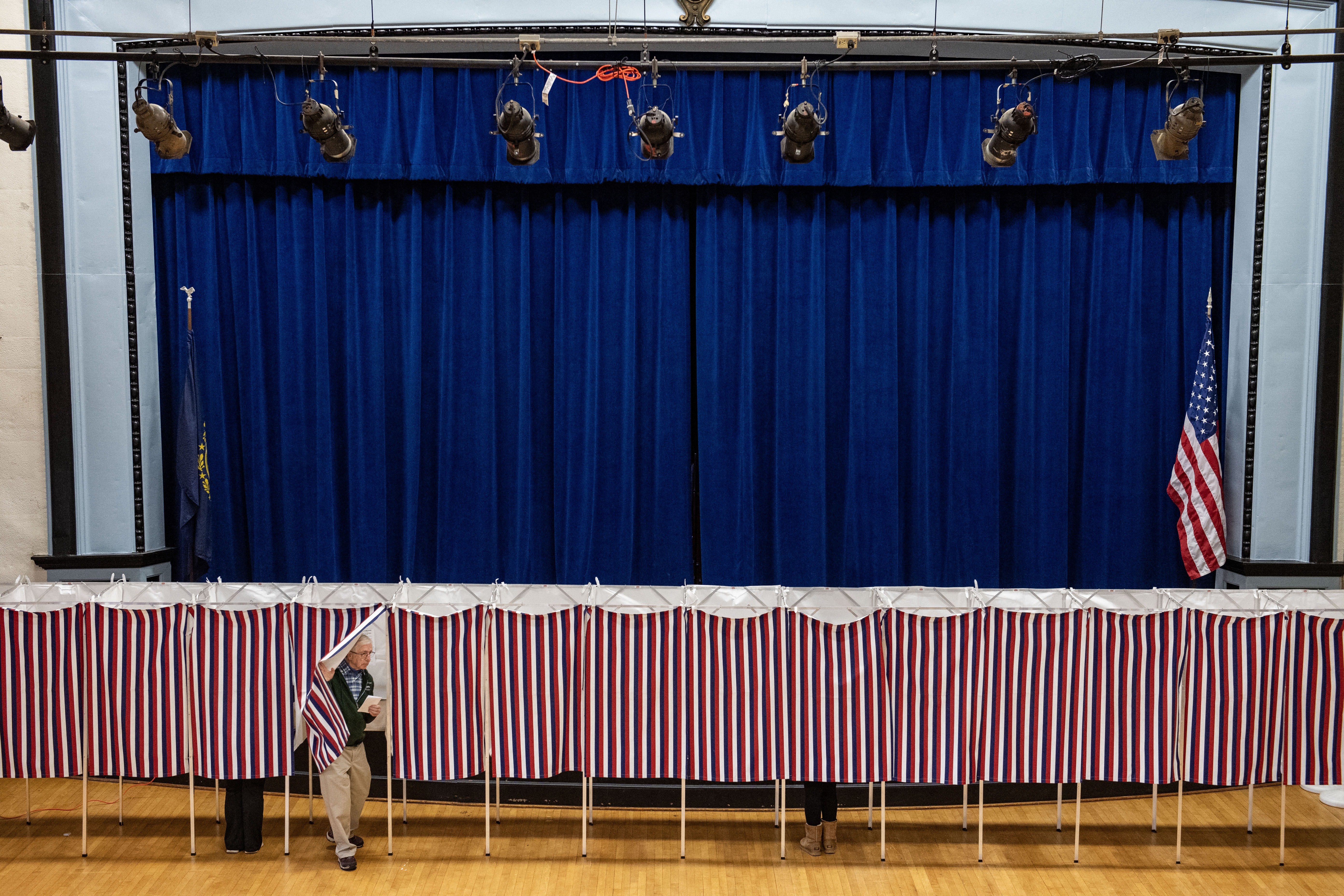 A man exits a voting booth at a polling station in Lancaster, N.H., on Election Day, Nov. 5, 2024.